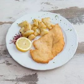Cotoletta di pollo con patate al forno